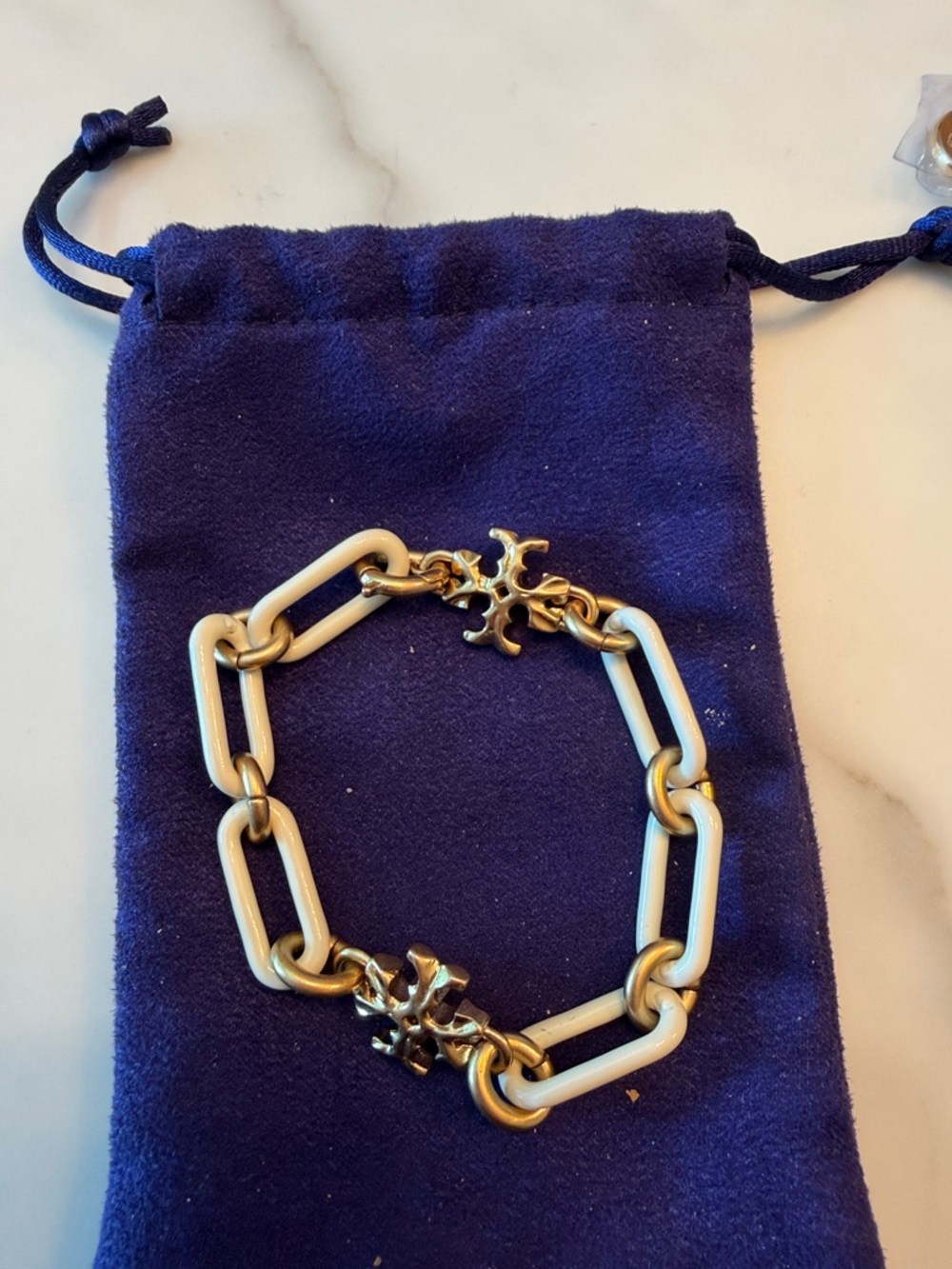 Tory Burch Gold and Cream Chain Link Bracelet with Decorative Cross Accents